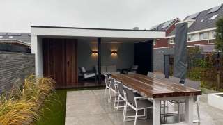 luxe tuin overkapping strak en modern tuinaanleg vakman hovenier