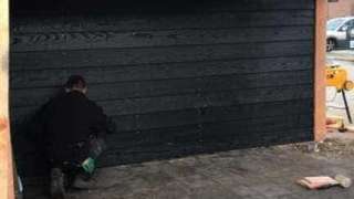 Douglas tuinoverkapping met zwart gespoten douglas planken 