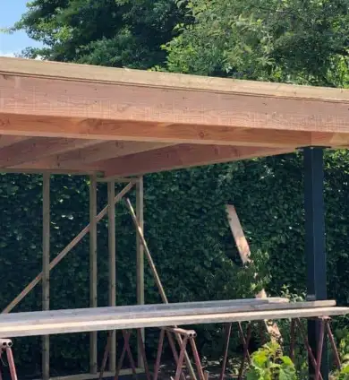 images/001-tuinaanleg-ettenleur/lies-sintmichelgestel/Tuinoverkapping-maken-kruispunt-390x424-fa3