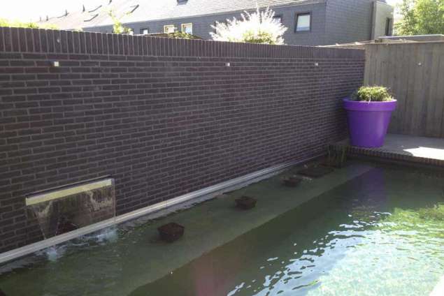 Uitvlakken beton en vlak maken zwemvijver, aanleggen Tilburg