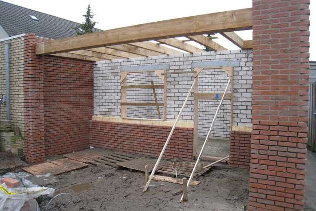 tuinmuur hoogte 180 cm lengte 550 cm in strakke tuin met grind in de wijk de blaak tilburg vught eindhoven oisterwijk modern