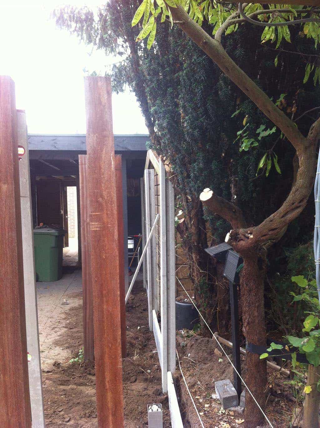 032betschutting/afbreken oude betons schutting kosten.JPG